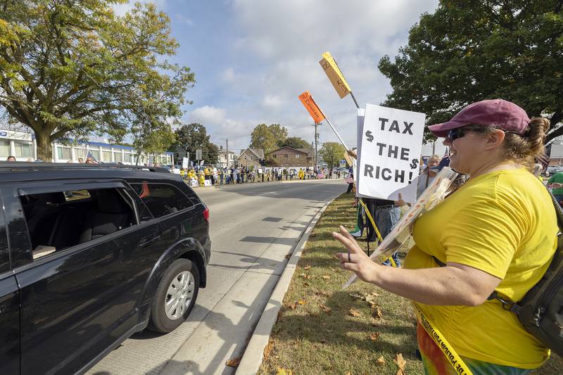 Protesters line Fourth Street in Sterling on Saturday, Oct. 18, 2025, joining hundreds of others showing their discontent with the Trump administration. The “No Kings” demonstration was just one of thousands across the U.S. and Europe rallying against President Donald Trump.