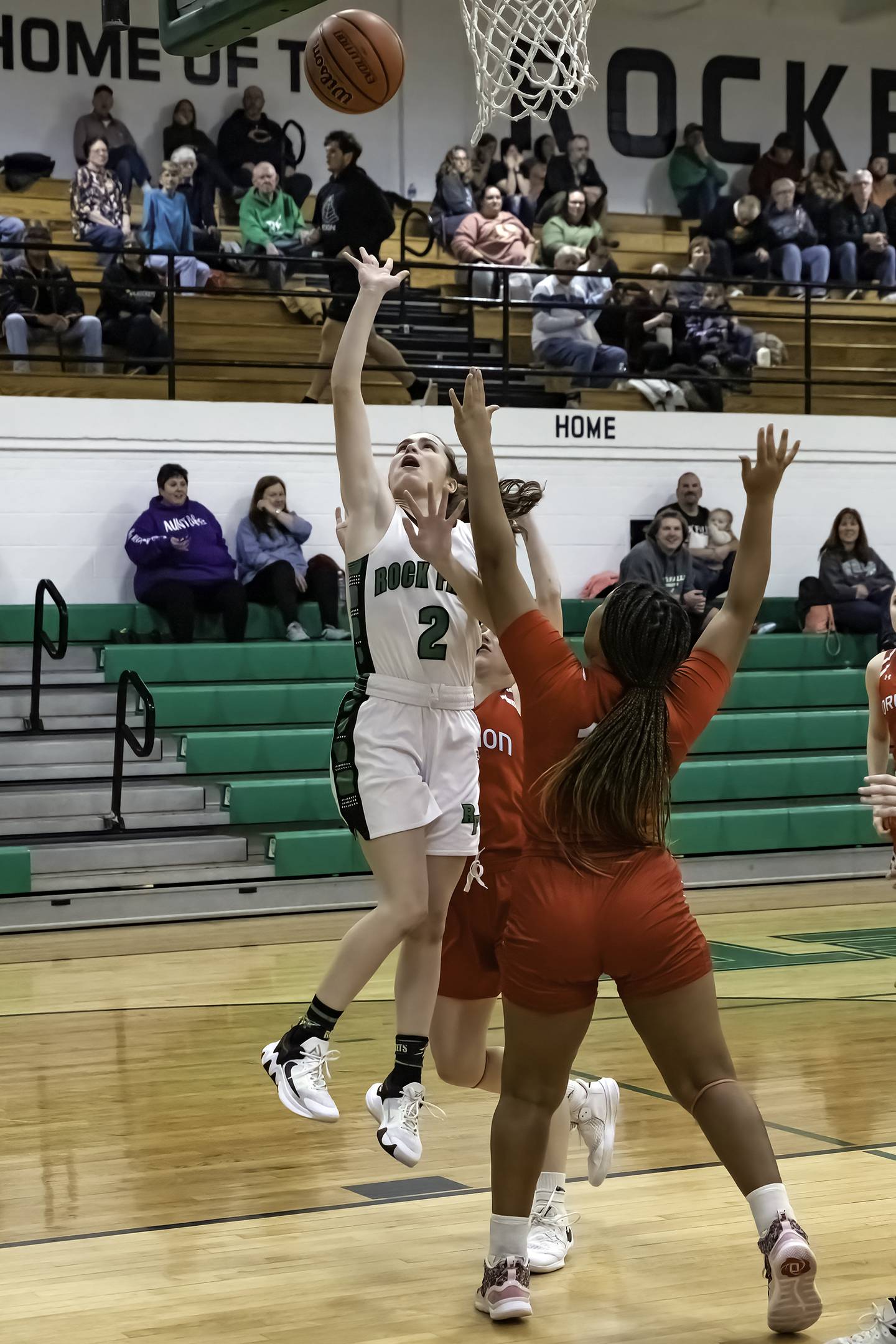 Rock Falls' Brooke Howard (2) shoots over Oregon's Mariah Drake during their Big Northern Conference game Friday night at Tabor Gym.