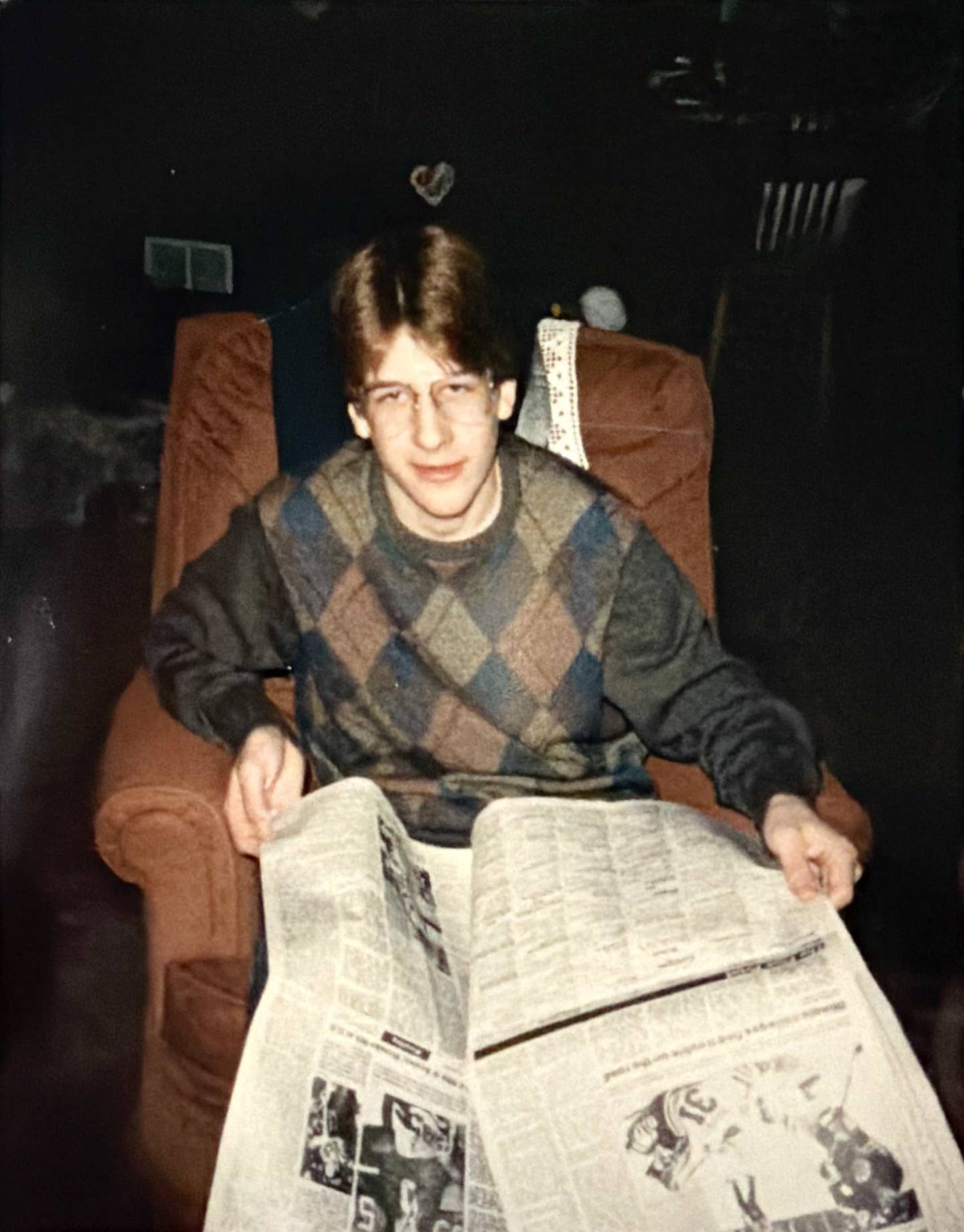 Alan Jerousek reading the sports section of the newspaper in 1985.