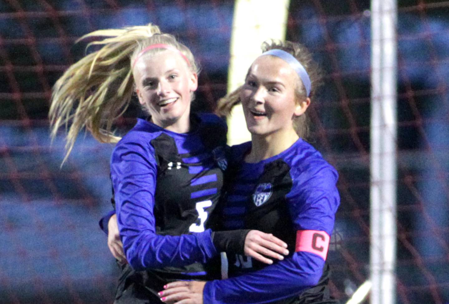 Geneva’s Audrey Stredde (left) and Julianna Drew celebrate Stredde’s goal in the first half during a Tri-Cities Night game against Batavia at Batavia High School on Tuesday, May 2, 2023.