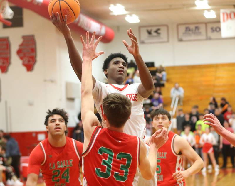 Streator's Sharonn Morton eyes the hoop as L-P's Gavin Stokes defends on Tuesday, Jan. 13, 2026 in Pops Dale Gymnasium at Streator High School.