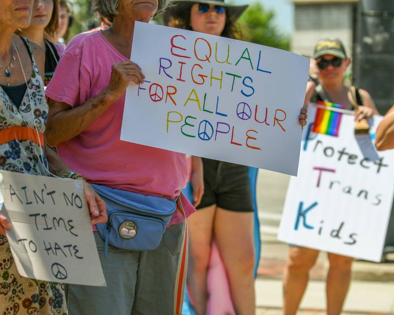 Handmade signs were shown off during a Trans Resilience Rally on Sunday, June 22, 2025, held at Memorial Park in DeKalb. Organizers said the rally was to show public support for people they believe are unjustly and harmfully targeted under President Donald Trump's policies.