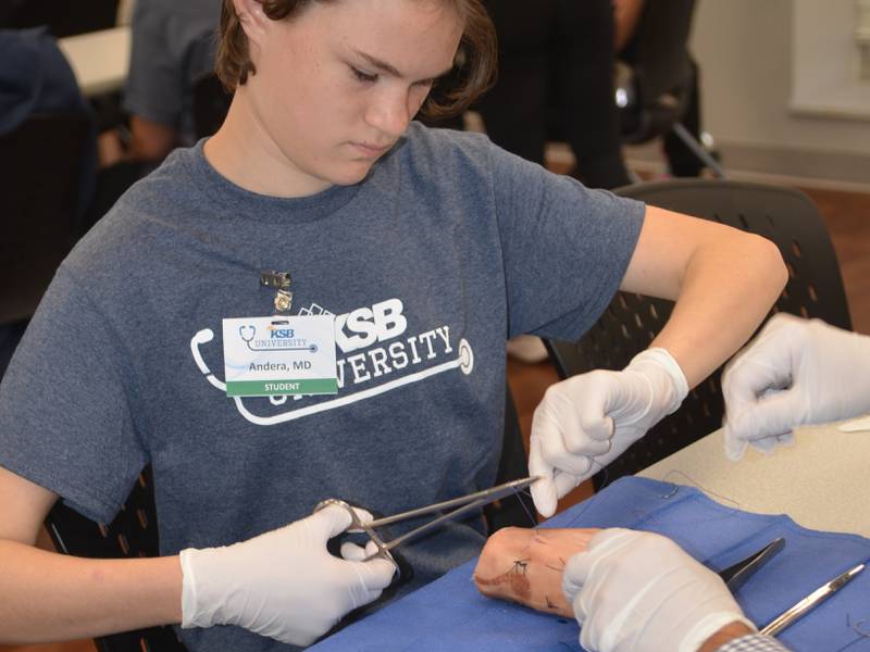 Andera Aldridge sutures a cut on a pig's foot Monday, Oct. 9, 2023, at KSB Hospital in Dixon.
