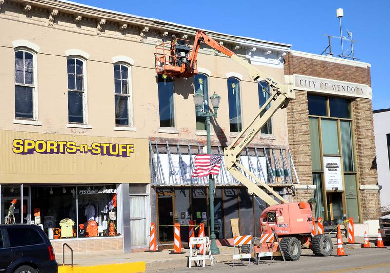 Dan Znaniecki of H&H Builders, applies a fresh coat of paint on the exterior of the Mendota Chamber of Commerce building on Monday, Oct. 27, 2025 downtown Mendota.