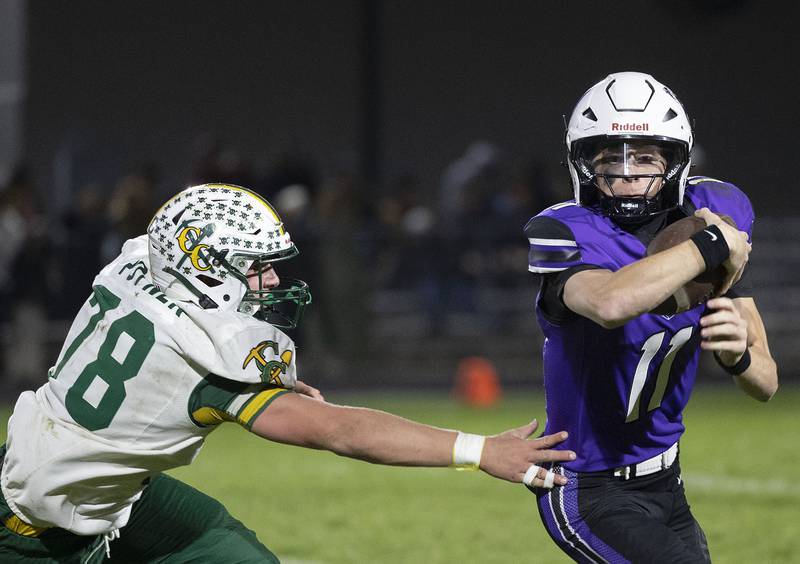 Dixon’s Jagger Kemp looks to get past Cola City’s Cade Poyner Friday, Nov. 7, 2025.