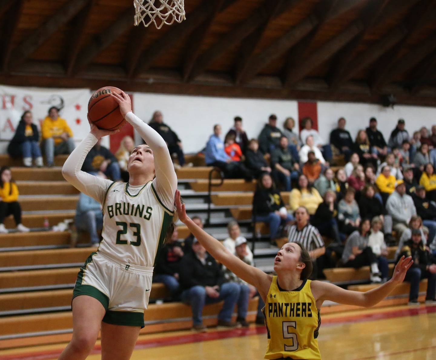 St. Bede's Ali Bosnich runs past Putnam County's Eme Bouxsein to score a basket during the Tri-County Conference Tournament championship game on Thursday, Jan. 18, 2024 at Henry-Senachwine High School.