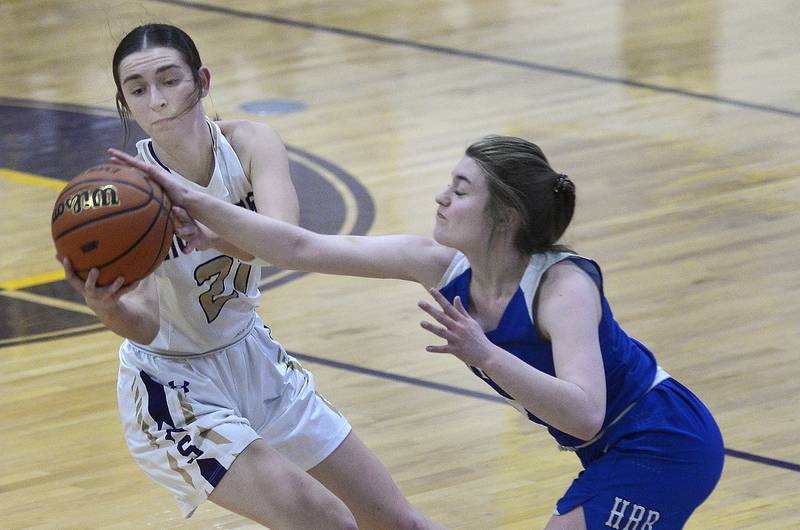 Serena’s Makayla McNally takes the ball away from Hinkley Big Rock’s Alyssa Swanson 2nd period during the Class 1A Sectional on Tuesday, Feb. 21, 2023 at Serena High School.