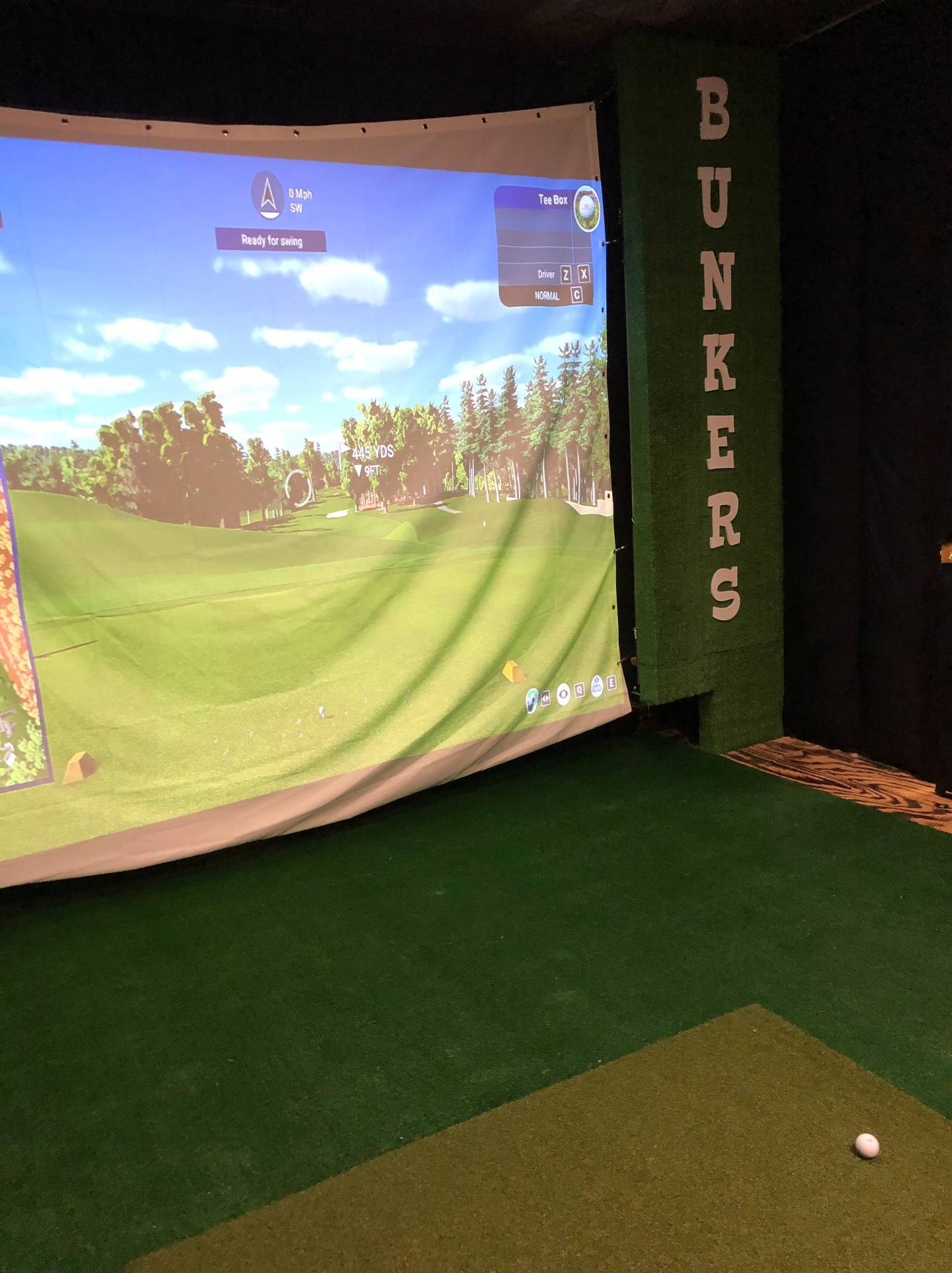 Bunkers Golf celebrates the opening of an indoor golf simulator with a ribbon cutting ceremony on Thursday, Oct. 13, 2022.