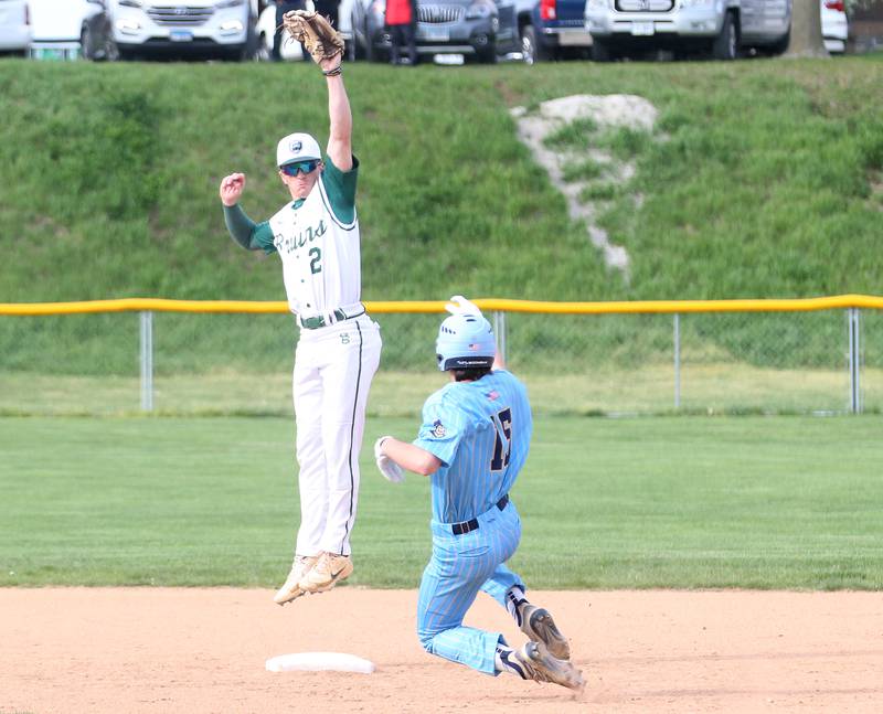 St. Bede's Gus Burr catches the ball on a high throw to second base as Marquette's Alec Novotney reaches the bag safely on Monday, April 22, 2024 at St. Bede Academy.