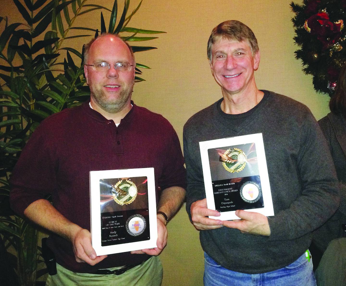Newman boys track coach Andy Accardi (left) was named the Class 1A Coach of the Year by the Illinois Track & Cross Country Coaches’ Association for 2013, while Sterling assistant Tom DePasquale was one of three assistant coaches of the year.