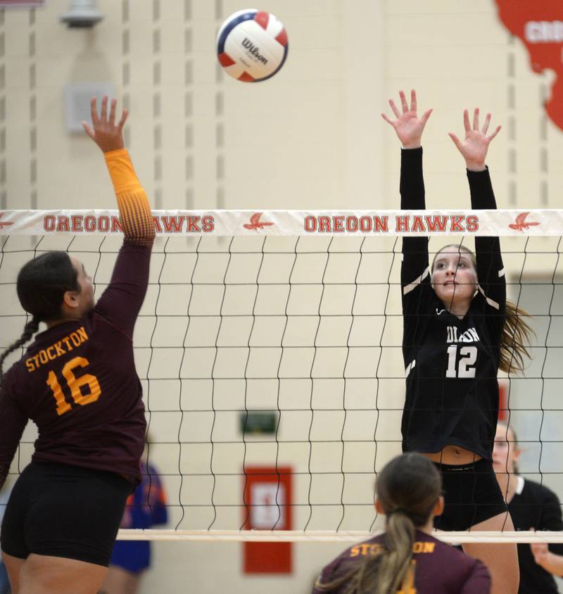 Dixon's Izzy Queckboerner (12) goes up tp block as Stockton's Ireland Mensendike (16) spikes during the championship match at the Oregon Varsity Girls Volleyball Tournament on Saturday, Sept. 6, 2025 at the Blackhawk Center in Oregon. Dixon fell in two matches.
