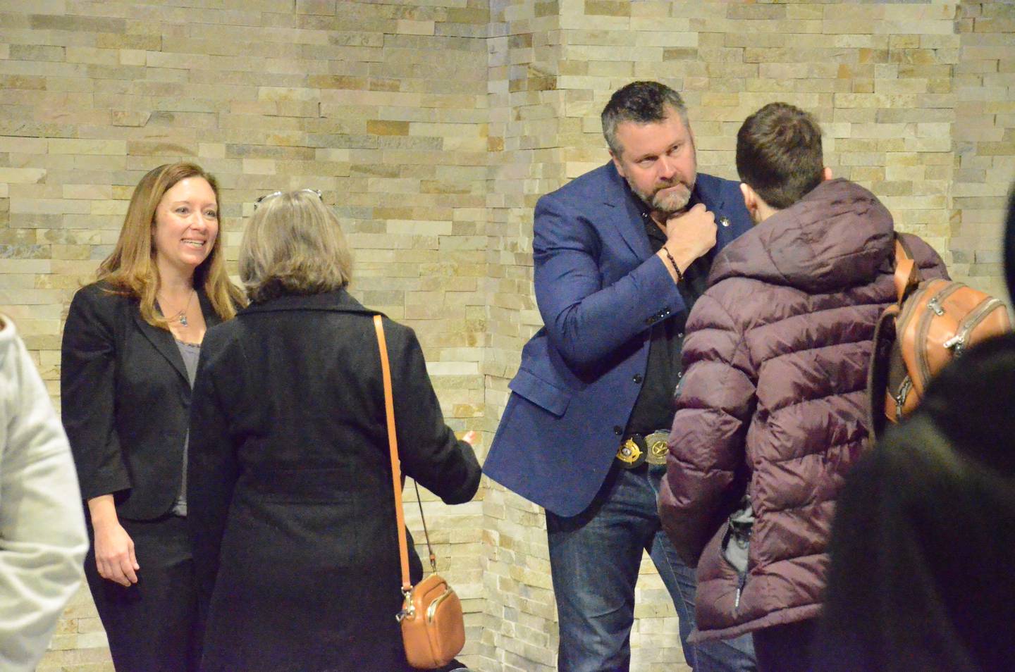 Kane County State's Attorney Jamie Mosser (left) and Sheriff Ron Hain chat with Aurora University students Monday morning. Addressing about 100 AU social work and criminal justice students in the university banquet hall, Mosser and Hain discussed  their roles in the criminal justice system.