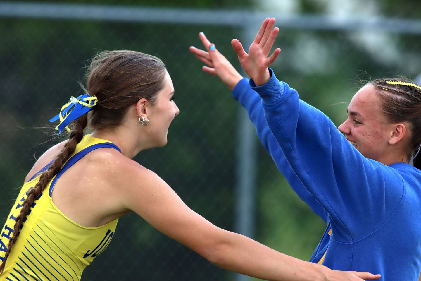 Johnsburg’s Carly Duck, left, is greeted by teammate Hope Klosowicz after Duck’s pole vault in IHSA Class 2A Girls Sectional Track action at Genoa-Kingston School in Genoa on Friday, May 16, 2025.