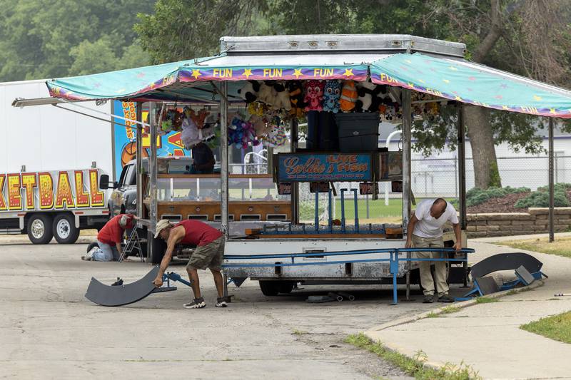 Games, rides and vendors for Dixon’s Petunia Fest carnival start to take shape Monday, June 26, 2023 along the riverfront in front of Dixon High School.