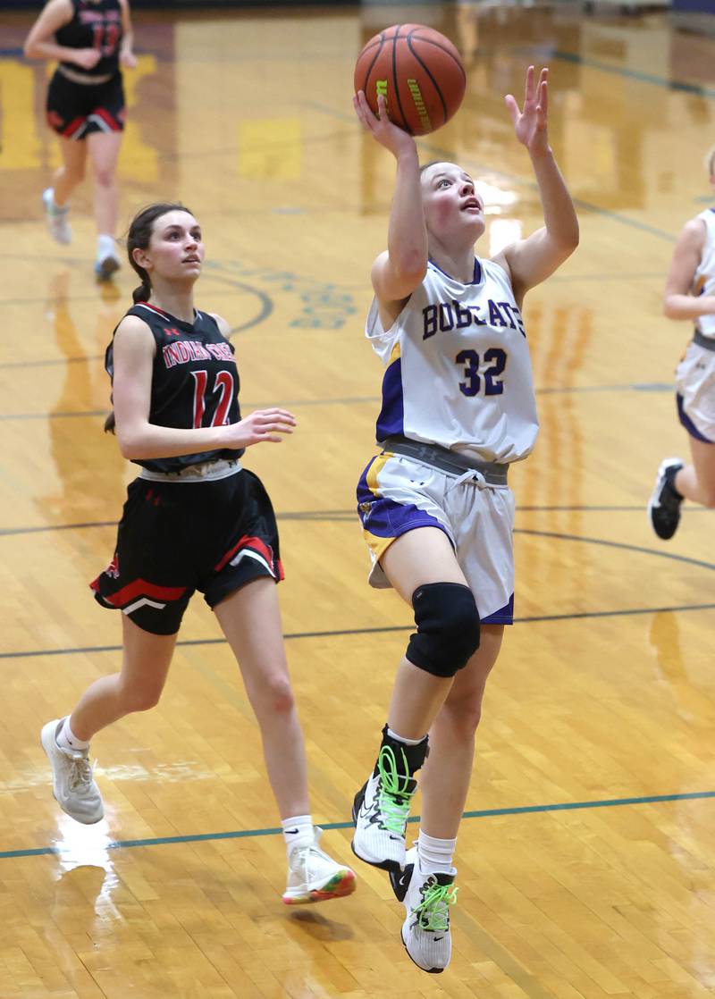 Somonauk's Haley McCoy scores on a fast break in front of Indian Creek's Isabella Turner during their game Monday, Jan. 9, 2023, at Somonauk High School.
