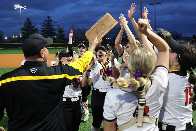 Lincoln-Way West receives the championship plaque after the Warriors 11-1 win over Lockport in the WJOL Softball Tournament championship game on Thursday, April 2, 2026 in Joliet.