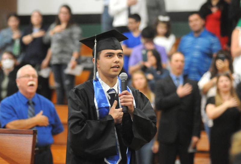 Alejandro Jose Medina leads the crowd in the Pledge of Allegiance Sunday, May 22, 2022, during the Alden-Hebron High School commencement ceremony in Hebron.