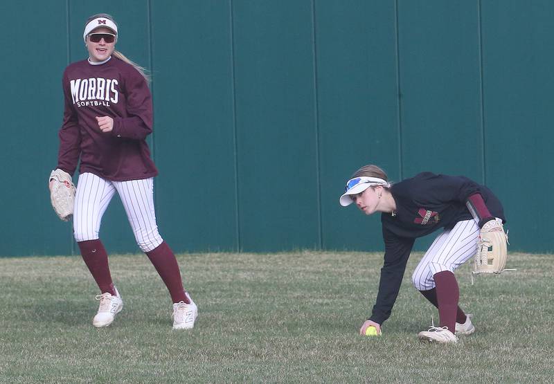 Morris right-fielder Cami Pfeifer bare hands the ball to throw it back to the infield as teammate Alyssa Jepson looks watches on Monday, April 7, 2025 at the L-P Athletic Complex in La Salle.