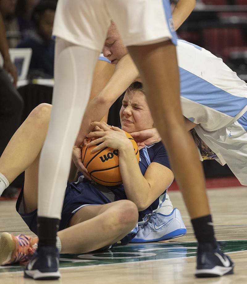 Nazareth’s Stella Sakalas grapples with Belleville East’s Vanessa Stacy Friday, March 6, 2026, in the Class 4A girls state semifinal game at CEFCU Arena at ISU.