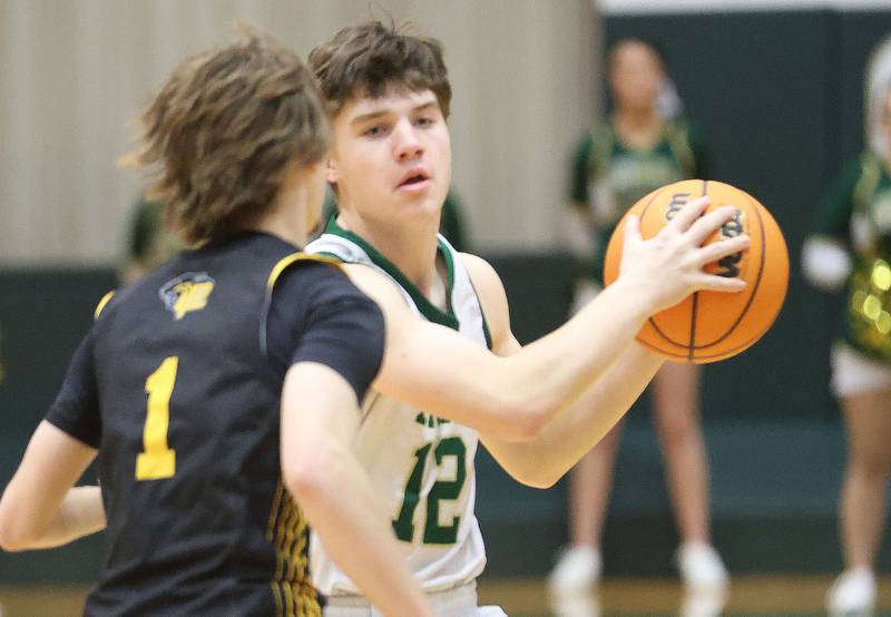 St. Bede's Carson Riva looks to pass the ball around Putnam County's Jacob Furar during the Class 1A Regional quarterfinal game on Monday, Feb. 23, 2026 at St. Bede Academy.