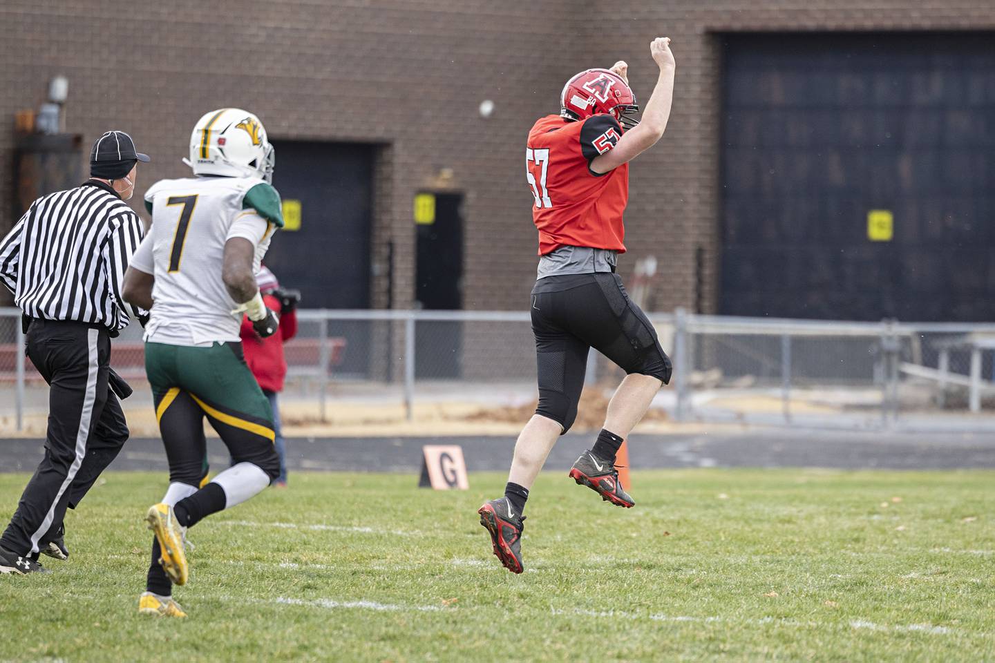 Amboy’s Trey Payne celebrates a last second first half touchdown Saturday, Nov. 12, 2022 against St. Thomas More during the 8-man semifinals.