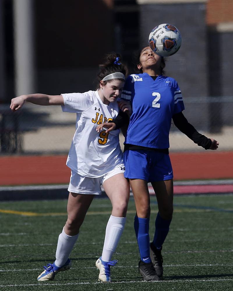 Jacobs' Brenna Flaskamp battles with Larkin’s Leila Nunez for the ball during a nonconference Huntley Invite girls soccer match Tuesday, March 28, 2023, at Huntley High School.