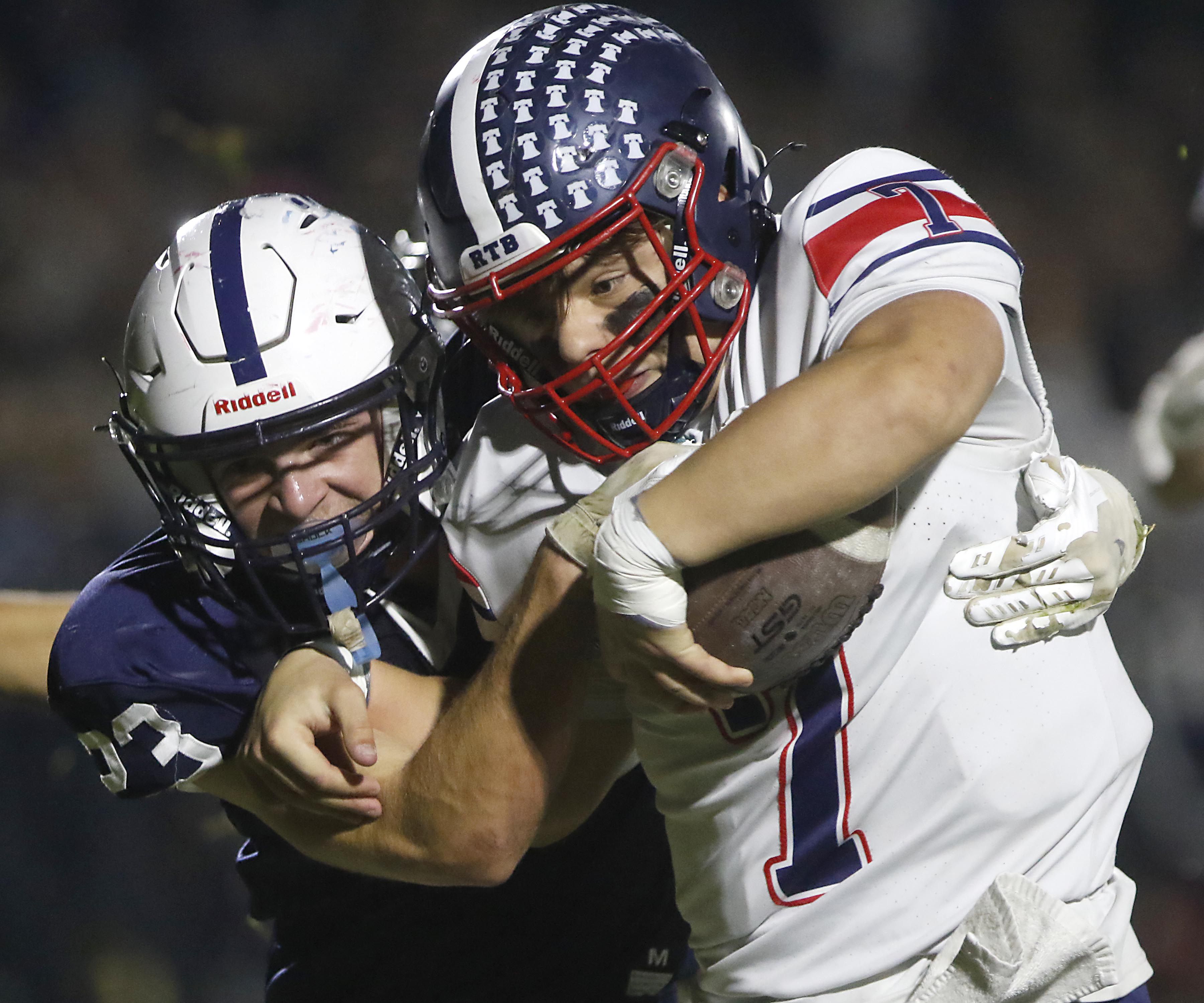 Cary-Grove's Lance Moore tackles Belvidere North's Andrew Bucci during an IHSA Class 5A quarterfinal playoff football game on Friday, November 14, 2025, at Cary-Grove High School, in Cary.