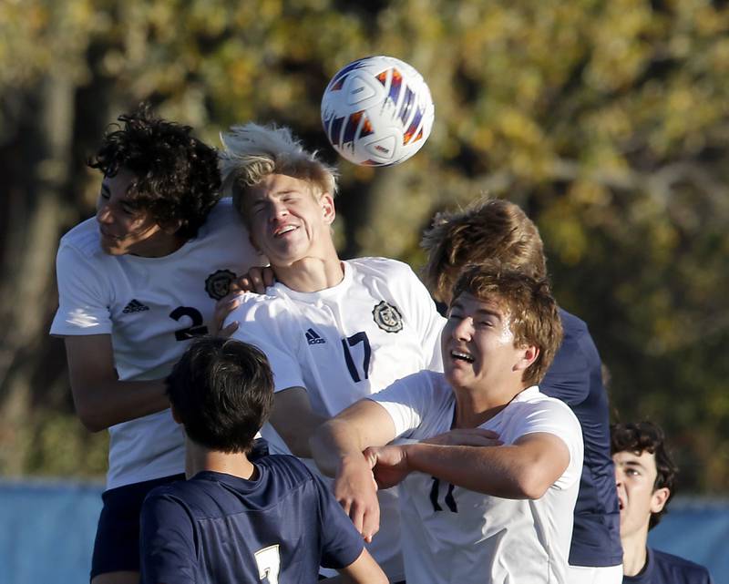 Lemont's Luciano Mancini, (left) Andrew Guzy, (center) and Lemont’s Mitchell Sowa (right) try to head the ball into the goal during an IHSA Class 3A state semifinal soccer match against Belleville Althoff Catholic on Friday, Nov. 8, 2024, at Hoffman Estates High School.