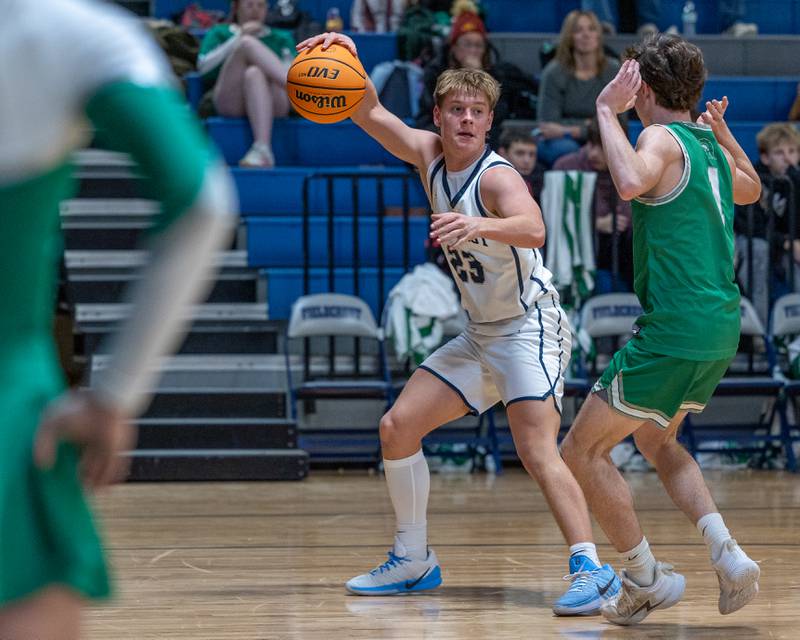 Eli Gerdes (23) of Fieldcrest dribbles ball as Joe Duffy (1) of Dwight guards on Monday, December 15, 2025 at Fieldcrest High School in Minonk.