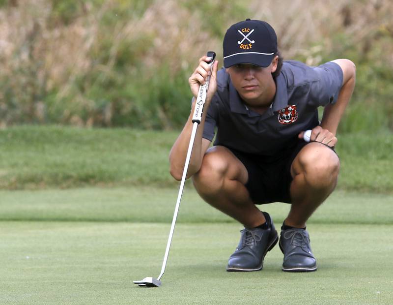 Crystal Lake Central’s Asher Johnson lines up his putt on the eighth green during the IHSA Class 2A Crystal Lake South Boys Golf Regional on Wednesday, Oct. 1, 2025 at RedTail Golf Club in Lakewood.
