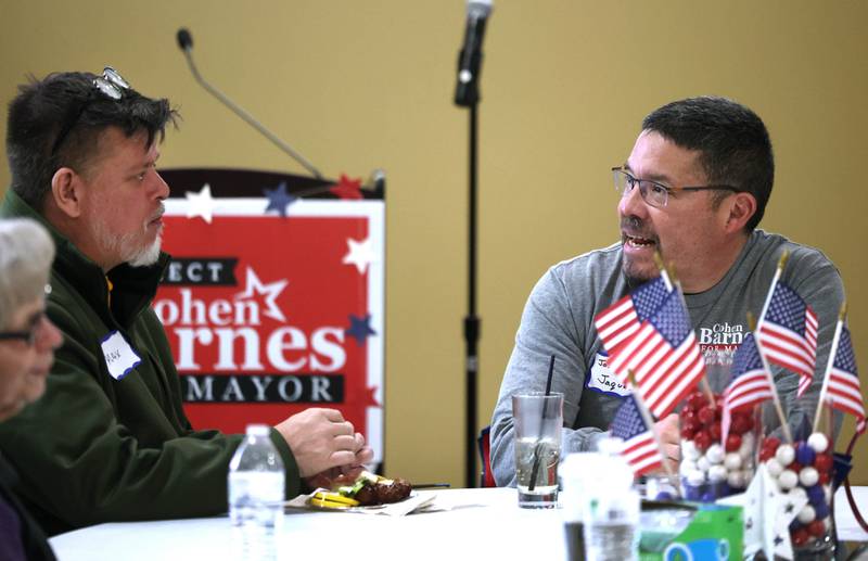 District 428 School Board candidate Jose Jaques (right) talks to an attendee Tuesday, April 1, 2025, during an election night party at Faranda's Banquets in DeKalb.
