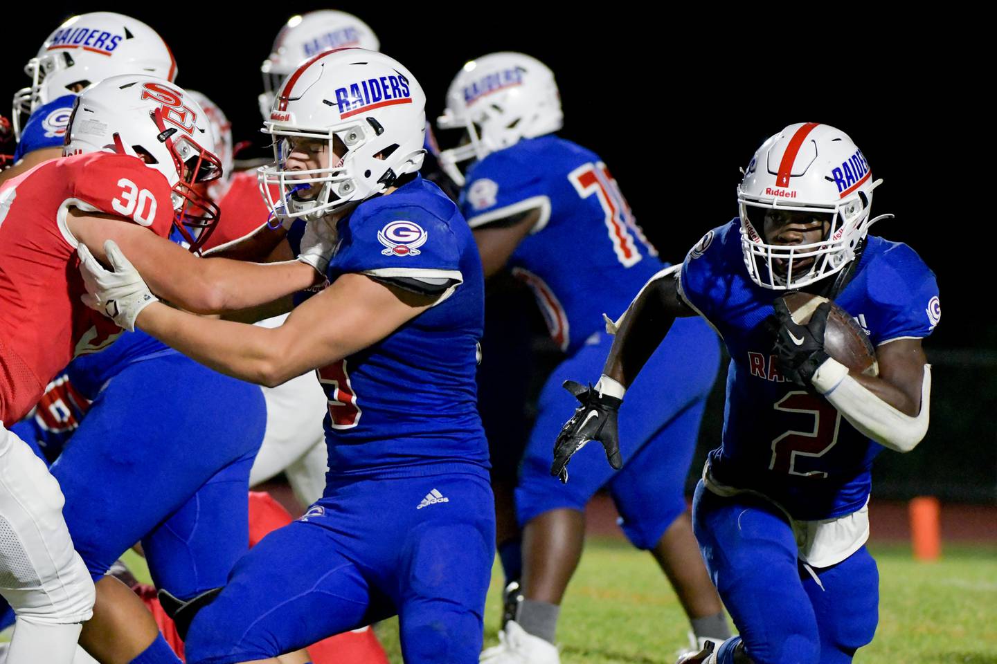 Glenbard South's Trevor Burnett (2) runs the ball against South Elgin during a game in South Elgin on Friday, September 10, 2021.