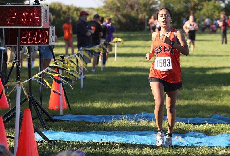 DeKalb's Brenda Aquino finishes the girls race Tuesday, Aug. 30, 2022, during the Sycamore Cross Country Invitational at Kishwaukee College in Malta.
