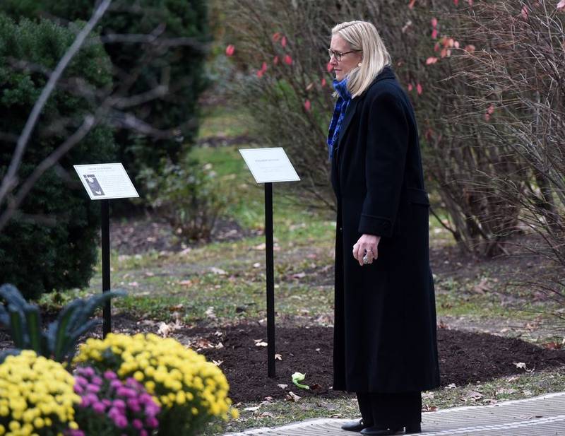 Highland Park Mayor Nancy Rotering visits a temporary memorial to the seven people killed on July 4 in November 2022. "We are still individually and collectively experiencing unbelievable grief and ongoing trauma," Rotering told the Daily Herald.