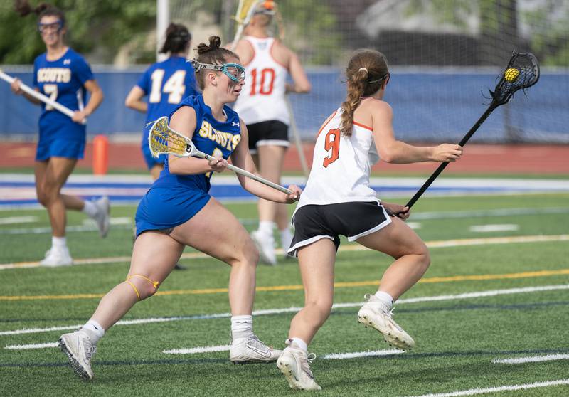 Lake Forest's Lissy Blume defends against Crystal Lake Central Co-Op's Fiona Lemke during the girls lacrosse supersectional match on Tuesday, May 31, 2022 at Hoffman Estates High School.