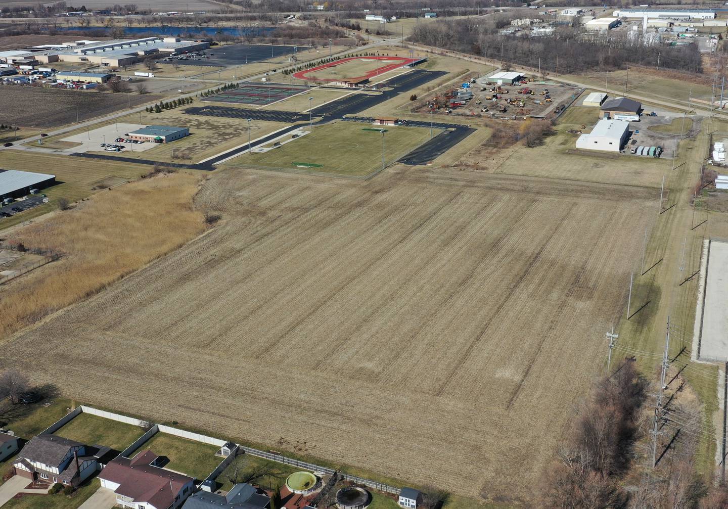 Here, looking north from Victoria Drive shows where phase two of the La Salle-Peru Township High School Athletic Complex on Tuesday, March 7, 2023 in La Salle.  This project will see the addition of competition baseball and softball diamonds, expansion of tennis courts, and installation of artificial turf to the school’s soccer field, along with expanded parking space. Additionally, restroom facilities will be added to the existing soccer field utility building and a structure will be built near the baseball/softball diamonds to serve as a concession stand, press box, and restrooms. The $9.5 million project is being completed without any increase to the community’s tax bill.
