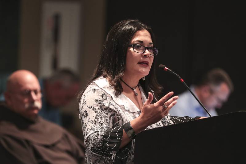 Alicia Morales, a member of the Collins Street Neighborhood Council speaks during public comment on Tuesday, Aug. 17, 2021, at Joliet City Hall in Joliet, Ill. Members of the Collins Street Neighborhood Council came out to speak against the city manager's decision to stop the Joliet Block Party event on Aug. 8.