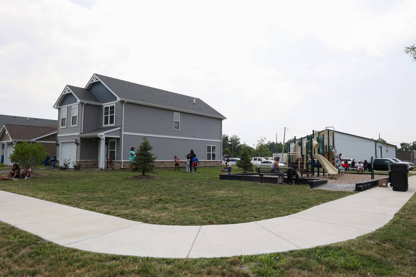 Children play near the playground along West Pace Boulevard at the new West Harbor Residences in Kankakee on Wednesday, July 23, 2025.
