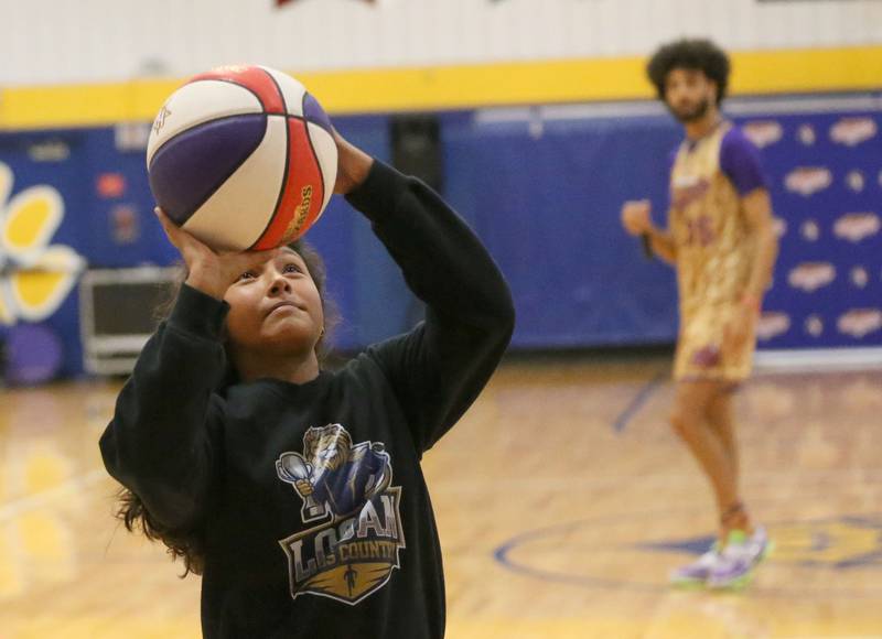 Kalliope Gasperecz, an eighth-grade student at Logan Jr. High School, shoots a layup during the Harlem Wizards event on Tuesday, Oct. 28, 2025 in Pannebaker Gymnasium at Logan Jr. High School in Princeton.
