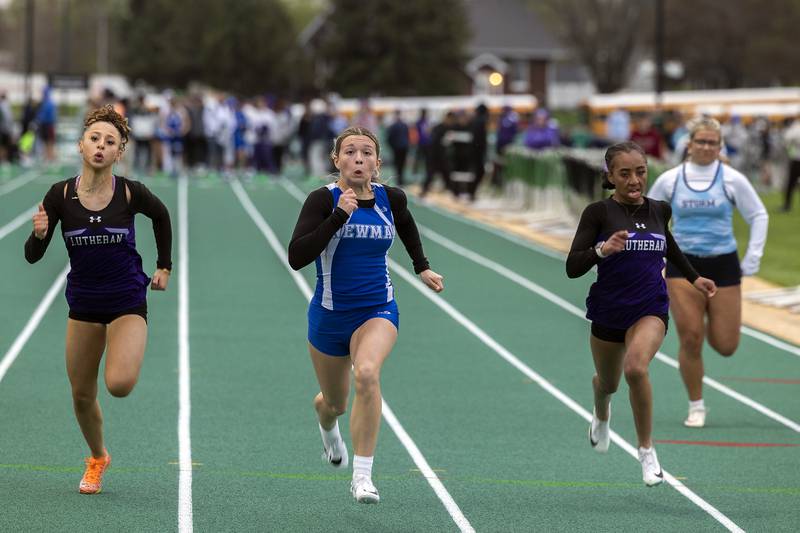 Newman’s Elaina Allen eyes the finish in the 100 dash Friday, April 25, 2025, during the Rock Falls Rocket Invite.