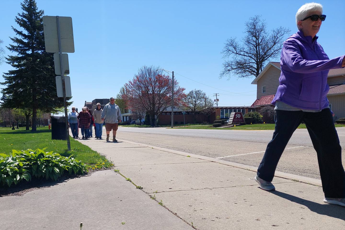 Walkers of all different paces participate Sunday, April 21, 2024, in the Streator Walking Club's regular walk two times around City Park.