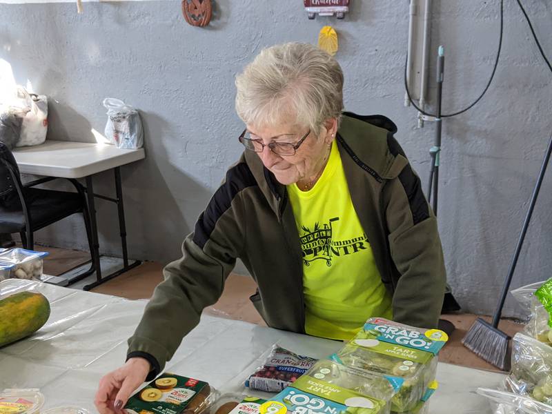 Kendall County Community Food Pantry volunteer Linda Wasielewski helps sort items at the pantry prior to the pantry's distribution day on Thursday, Oct. 30, 2025.