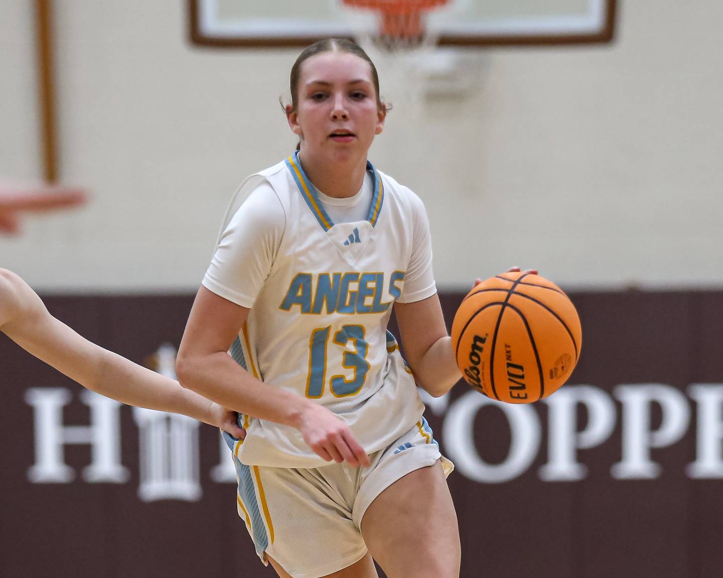 Joliet Catholic's Abby Dulinsky (13) drives down the lane during their basketball game between Providence Catholic at Joliet Catholic. Feb 11, 2025 in Joliet.