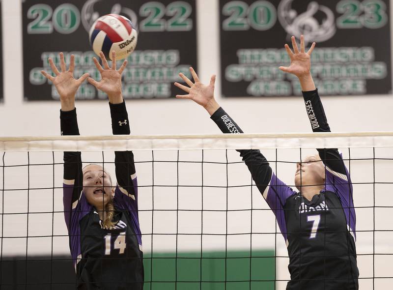 Dixon’s Leah Carlson and] Makenzie Toms go up for a block against Rock Falls Thursday, Sept. 19, 2024, in a Big Northern Conference match at RFHS.