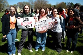 (Left to right) BHS Students Against Gun Violence organizers Roczie Line, Anna Roberts, Ellie Carter, Skylar Eastham and Mithali Obadage gather among hundreds of classmates during a school walk-out on Friday, April 19, 2024.