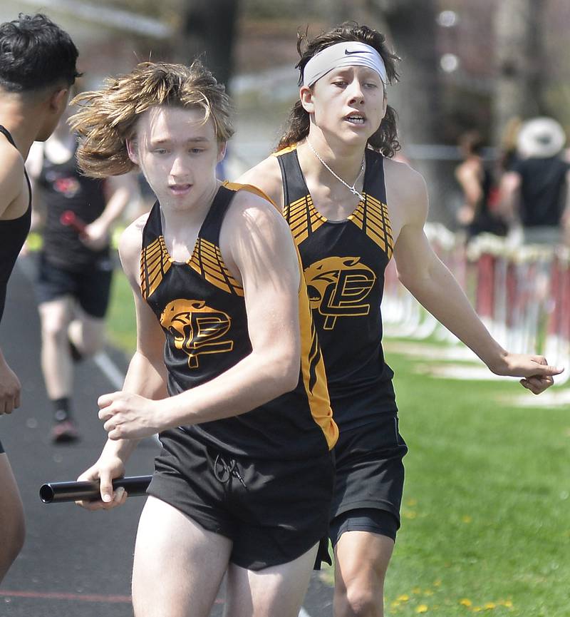 Putnam Counties Braden Bickerman Cayden Bouxsein compete  in the 4x800 relay during the Rollie Morris Invite on Saturday, April 15, 2023 at Hall High School.