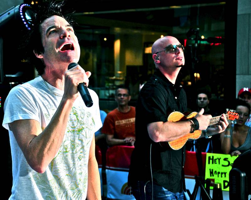 Lead singer of Train, Pat Monahan, sings alongside guitarist Jimmy Stafford, a Morris native. Stafford is speaking to Morris Community High School honor students Wednesday at the annual Honors Night.