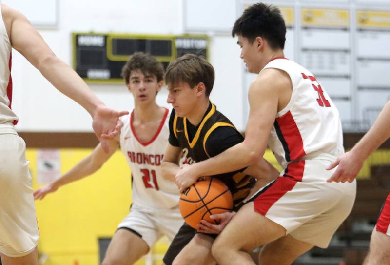 Jacobs’ Nolan Roper battles through heavy traffic against Barrington during Hinkle Holiday Classic varsity boys basketball tournament action on Monday, Dec. 23, 2024 at Jacobs High School in Algonquin.