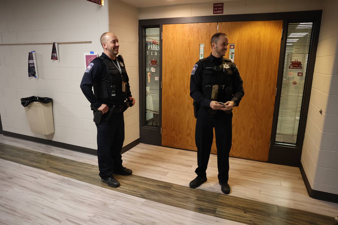 Lockport Police Officer and LTHS Resource Officers Kevin Brauch, left, and Cameron Kamarauskas walk the halls at Lockport high school’s main campus on Monday, April 8.