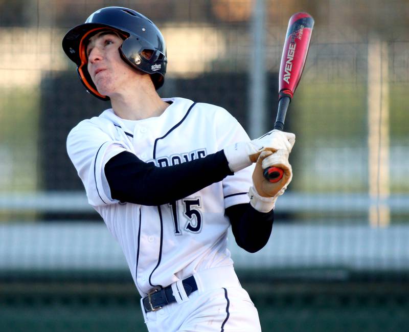Cary-Grove’s Charlie Taczy makes contact in the seventh inning against Huntley in varsity baseball at Cary Wednesday night.